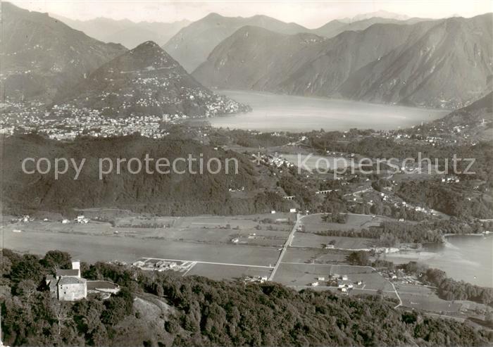 13795165 Agno Lago di Lugano TI Fliegeraufnahme Blick v. Santa Maria auf Agno -