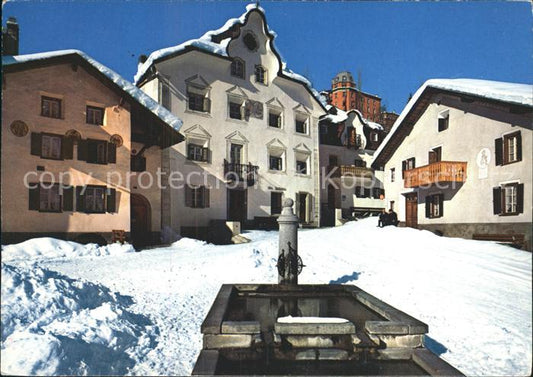 12233187 Scuol Tarasp Vulpera Dorfplatz mit Brunnen