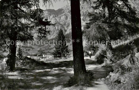 13816031 Leukerbad Loueche-les-Bains VS Waldweg bei Leukerbad mit Gemmiwand