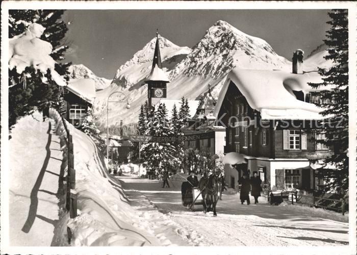 11631112 Arosa GR Strassenpartie mit Pferdeshlitten und Kirchturm