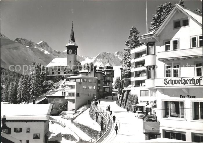 11631121 Arosa GR Strassenpartie mit Kirche und Hotel Schweizerhof