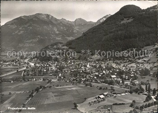 11631852 Mollis Gesamtansicht mit Alpenpanorama Fliegeraufnahme