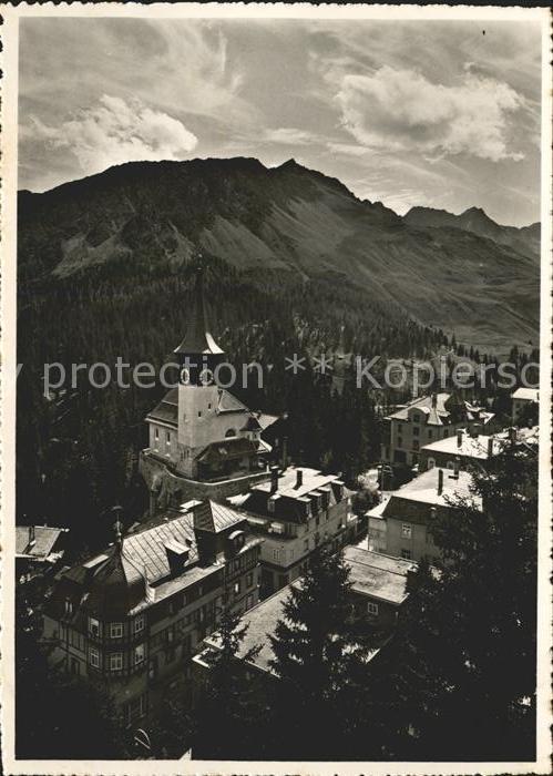 11641118 Arosa GR Dorfkirche mit Schafruecken Alpenpanorama